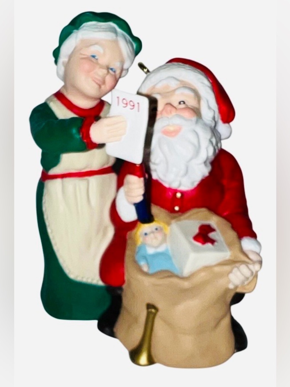 Mr. And Mrs. Clause Hallmark Santa and Mrs. Claus checking his list